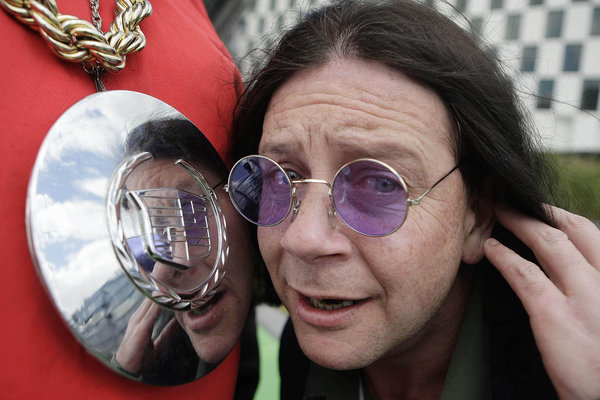 Nick Nicolas fixes his hair in a break dancers medallion at the launch of the AIB street championships at Grand canal dock in Dublin, Ireland.[CFP] 