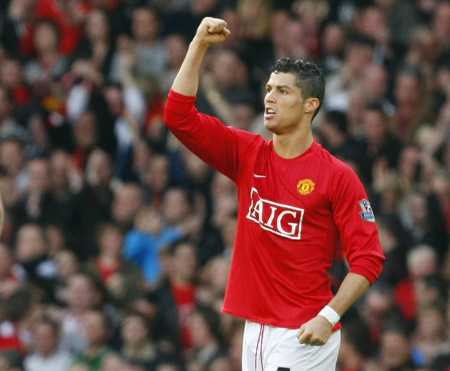 Manchester United's Cristiano Ronaldo is seen celebrating after scoring his second goal during their English Premier League soccer match against Aston Villa in Manchester, northern England in this April 5 2009 file photograph. Manchester United said on June 11, 2009 they have received a world record 80 million pound ($131.2 million) bid for forward Cristiano Ronaldo from Real Madrid. (Xinhua/Reuters Photo)