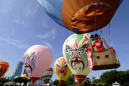 Fire balloons rise during the Third Haikou Fire Balloon Festival in Haikou, capital of south China's Hainan Province, June 12, 2009. A total of 25 teams took part in the event. (Xinhua/Zhao Yingquan)