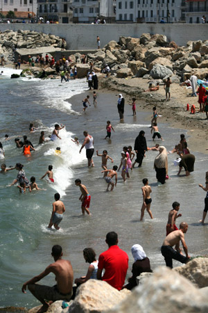 People play at a coast in Algiers, capital of Algeria, June 14, 2009. A total of 54 coasts of the city have been opened to the public. [Yin Ke/Xinhua] 