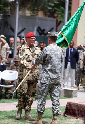  German General Egon Ramms (L) hands over the flag of the International Security Assistance Force (ISAF) to U.S. General Stanley McChrystal during a change of command ceremony in Kabul, capital of Afghanistan, June 15, 2009. New commander of the NATO-led ISAF in Afghanistan U.S. General Stanley McChrystal has vowed to accelerate security and development in the war-torn country, a statement of the alliance released here Monday said. [Zabi Tamanna/Xinhua]