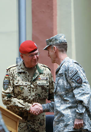 International Security Assistance Force (ISAF) commander, U.S. General Stanley McChrystal (R) shakes hands with German General Egon Ramms during a change of command ceremony in Kabul, capital of Afghanistan, June 15, 2009. New commander of the NATO-led ISAF in Afghanistan General Stanley McChrystal has vowed to accelerate security and development in the war-torn country, a statement of the alliance released here Monday said. [Zabi Tamanna/Xinhua]