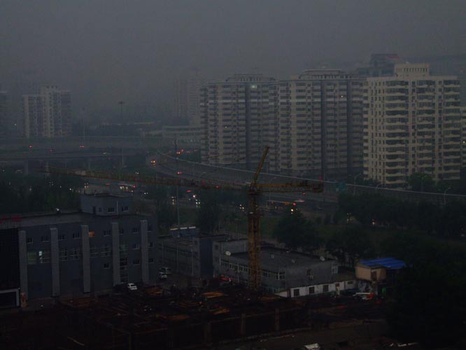 A heavy thunder storm hits Beijing Tuesday morning, causing darkness in the city during the daytime.[CFP] 