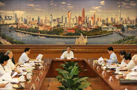 Wu Bangguo (C), chairman of the Standing Committee of China's National People's Congress (NPC), the country's top legislature, presides over the 25th meeting of the chairman and vice-chairpersons of the 11th NPC Standing Committee in Beijing, capital of China, June 15, 2009. 