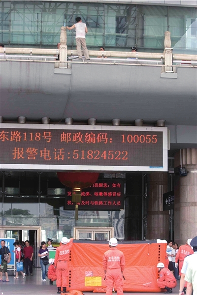 The rescuers confronted a man standing at the entrance on the second floor of Beijing Western Railway Station on June 15.