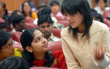 A Chinese student talks with her Indian classmates during a course. Today, more than 1,200 Chinese students are going to India to study IT, English, finance and commerce at a dozen Indian universities.