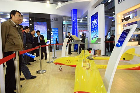 A lemon-yellow 'Blade' pilotless aircraft on display in the 16th Tianjin Trade Fair and Investment Talk in Tianjin on April 20, 2009.