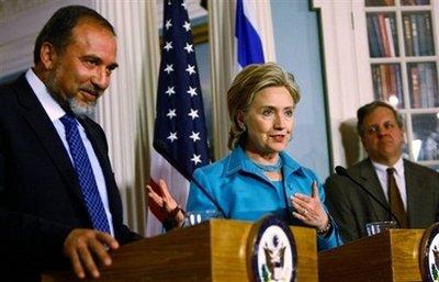US Secretary of State Hillary Clinton (C) and Israeli Deputy Prime Minister and Minister of Foreign Affairs of Israel Avigdor Lieberman (L) hold a joint press conference at the US State Department in Washington, DC. [Win Mcnamee/AFP/Getty Images] 