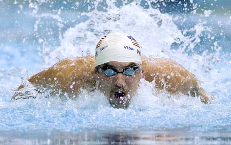 Michael Phelps swims to a win in the 100m butterfly competition at the Canada Cup swimming competition in Montreal June 20, 2009.