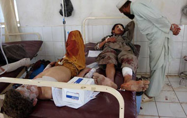 Afghan people who wounded in a blast lay in a hospital in Khost Province of eastern Afhganistan, on June 22, 2009. Twin suicide bombings shocked Khost province on Monday, leaving seven people dead and some forty others injured.