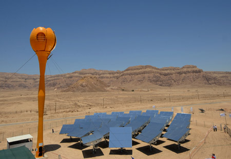 Photo taken on June 24, 2009 shows the solar receiver of the world's first hybrid solar thermal gas turbine power station at Kibbutz Samar in southern Israel. Each of the station's 30 heliostats tracks the sun and reflects its rays towards a special solar receiver, where it heats compressed air that drives a gas turbine. The turbine converts the thermal energy into electric power.(Xinhua/Yin Bogu)
