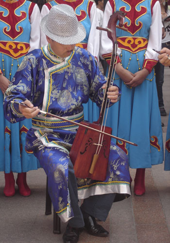  A Mongolian man plays a horse-head fiddle