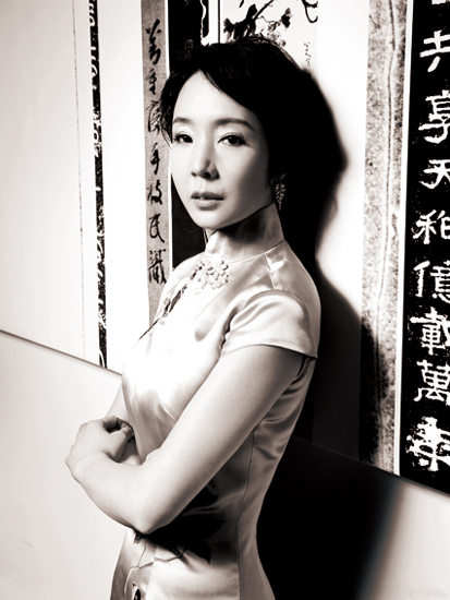 Chinese novelist Yan Geling poses in classic Chinese-styled long gown.