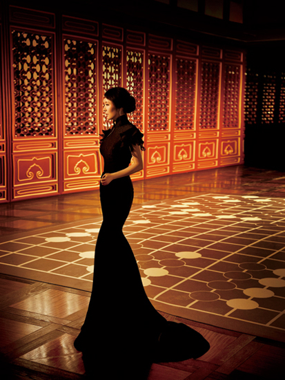 Chinese novelist Yan Geling poses in classic Chinese-styled long gown.