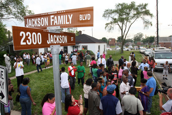 People gather outside the former childhood home of Pop Star Michael Jackson on June 25, 2009 in Gary, Indiana.