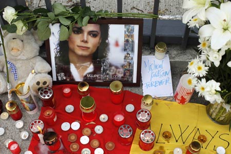 A shrine for Michael Jackson is set up in front of the U.S. embassy in Bucharest June 26, 2009. Jackson, the child star turned King of Pop who set the world dancing but whose musical genius was overshadowed by a bizarre lifestyle and sex scandals, died on Thursday. He was 50.