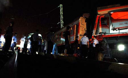 Two passenger trains collided in central China Monday morning, leaving at least three people dead and 60 injured on June 29, 2009.