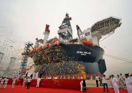 The Sevan Driller, the world's first cylinder-shaped deep sea water crude oil rig and bulky storage platform, which is constructed by the Nantong Shipyard under China Ocean Shipping (Group) Company (COSCO), is unveiled during a launching ceremony in Nantong City, east China's Jiangsu Province, June 28, 2009. The rig boasts a capacity of drilling of wells up to 40,000 feet in water depths of up to 12,500 feet, a variable deckload of more than 15,000 metric tons and high storage capacity of bulk materials. (Xinhua/He Jianrong) 