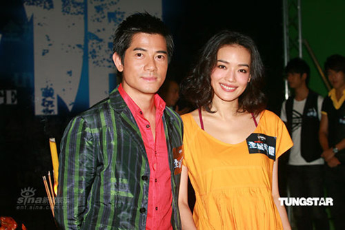 Cast members Aaron Kwok (left) and Shu Qi promote the sci-fi action film 'City under Siege' in Hong Kong on June 24, 2009. 
