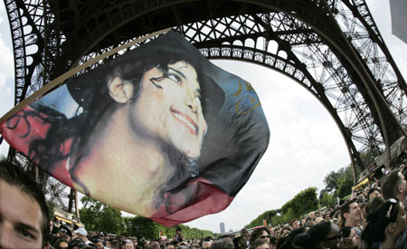 Michael Jackson fans gather near the Eiffel Tower in Paris, June 28, 2009. Jackson, the child star turned King of Pop who set the world dancing but whose musical genius was overshadowed by a bizarre lifestyle and sex scandals, died on Thursday. He was 50.