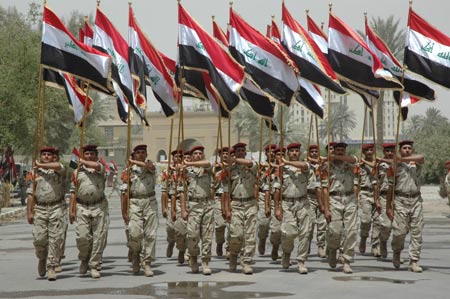 Iraqi honor guard march during a hand-over ceremony from the U.S. military to Iraq security forces in Baghdad, capital of Iraq, June 29, 2009. June 30 is the deadline for U.S. combat troops to withdraw from major cities in Iraq. (Xinhua)