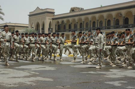 Iraqi honor guard march during a hand-over ceremony from the U.S. military to Iraq security forces in Baghdad, capital of Iraq, June 29, 2009. June 30 is the deadline for U.S. combat troops to withdraw from major cities in Iraq. (Xinhua)