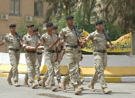 Iraqi honor guard march during a hand-over ceremony from the U.S. military to Iraq security forces in Baghdad, capital of Iraq, June 29, 2009. June 30 is the deadline for U.S. combat troops to withdraw from major cities in Iraq. (Xinhua)