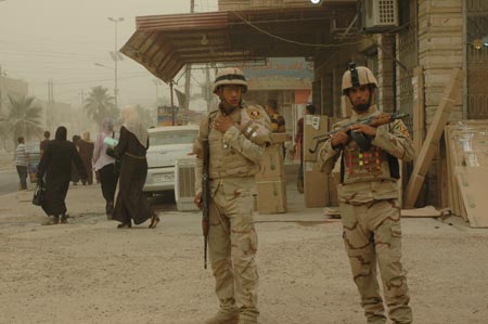 Soldiers of Iraqi security forces patrol the streets in Baghdad, capital of Iraq, on June 28, 2009. As part of a security pact signed between Baghdad and Washington last year, U.S. troops will withdraw from Iraq's cities, towns and villages by June 30, 2009 to their bases, and will leave the country by December 31, 2011. (Xinhua/Gao Shan) 