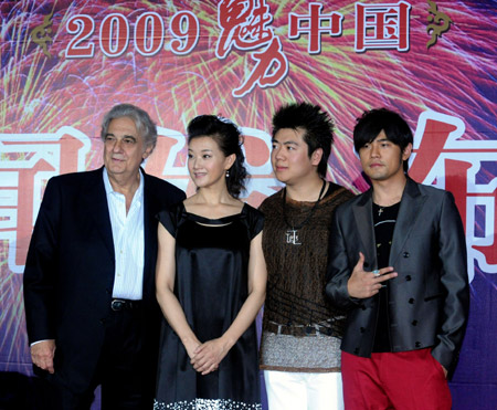 Spain tenor Placido Domingo (1st L), Chinese singer Song Zuying (2nd L), Chinese pianist Lang Lang (3rd L) and Chinese Taipei pop singer Jay Chou pose for a group photo at a press conference in Beijing, China, June 28, 2009, one day before their concert at the Bird's Nest in Beijing. (Xinhua Photo)