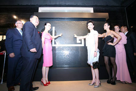 Actresses Zhang Ziyi and Carina Lau attend an opening ceremony of a jewelry accessories store co-run by famous hostess Yang Lan and Canadian pop diva Celine Dion, Sunday, June 28, 2009. 