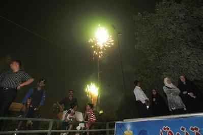 Fireworks light up the night sky above Baghdad, Iraq, Monday, June 29, 2009. U.S. troops will be out of Iraqi cities by tomorrow Tuesday June 30 in the first step toward winding down the American war effort by the end of 2011. [Khalid Mohammed/AP Photo] 