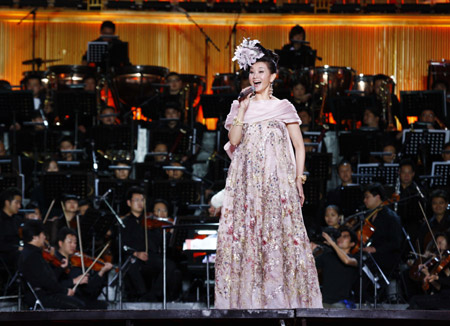 Song Zuying, a famous Chinese singer, performs singing at the 'Beijing Bird's Nest Summer Concert' at the National Stadium, or the 'Bird's Nest', in Beijing, June 30, 2009.