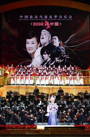 Song Zuying, a famous Chinese singer, performs singing at the 'Beijing Bird's Nest Summer Concert' at the National Stadium, or the 'Bird's Nest', in Beijing, June 30, 2009. 