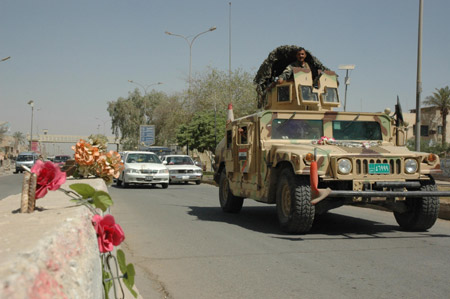 A Hummer of Iraqi military force patrols at a check point in Baghdad, capital of Iraq, July 1, 2009, the first day after U.S. combat troops withdrawing from major cities in Iraq. As part of a security pact signed between Baghdad and Washington last year, U.S. troops withdrew from Iraq's cities, towns and villages by June 30, 2009 back to their bases, and will leave the country by Dec. 31, 2011. (Xinhua/Gao Shan)