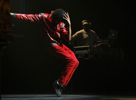 Michael Jackson fan Mike Rios dances before a Michael Jackson themed version of 'Amateur Night' at the Apollo Theater in New York July 1, 2009. 