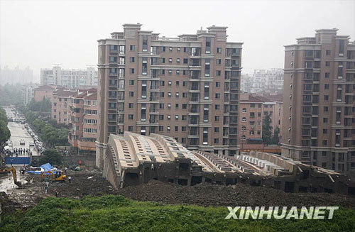The toppled apartment building on Lianhua Road, Minhang District in Shanghai was seen in this picture taken on June 27, the day when the building collapsed. [File Photo: Xinhuanet]