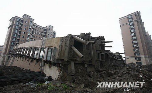 The toppled apartment building on Lianhua Road, Minhang District in Shanghai was seen in this picture taken on June 27, the day when the building collapsed.