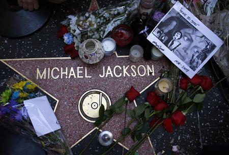 Flowers are placed on the star of Michael Jackson on the Hollywood Walk of Fame in Hollywood, California July 1, 2009.