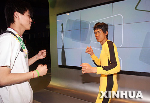 A visitor looks on a Bruce Lee wax figure in the Madam Tussauds Museum in Shanghai on this file photo. 