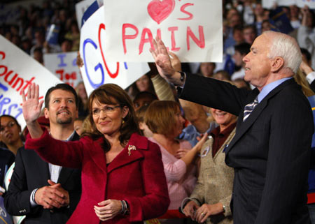 U.S. Republican presidential nominee Senator John McCain (R-AZ) is joined by U.S. Republican vice-presidential nominee Alaska Governor Sarah Palin (C) and her husband Todd (L) at a campaign rally in Hershey, Pennsylvania October 28, 2008.(Xinhua/Reuters Photo)