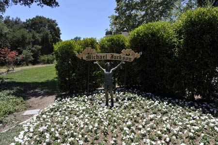 A bronze statue overlooks a road leading to the main house inside Michael Jackson's Neverland Ranch in Los Olivos, California on July 3, 2009.