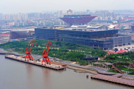 Photo taken on July 4, 2009 shows buildings under construction for the Shanghai 2010 World Expo in Shanghai, east China. The Shanghai 2010 World Expo is to open on May 1, 2010. [Xinhua]