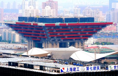 Photo taken on July 4, 2009 shows the China Pavilion under construction for the Shanghai 2010 World Expo in Shanghai, east China. The Shanghai 2010 World Expo is to open on May 1, 2010. [Guo Changyao/Xinhua]