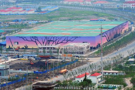 Photo taken on July 4, 2009 shows the African Associated Pavilion under construction for the Shanghai 2010 World Expo in Shanghai, east China. The Shanghai 2010 World Expo is to open on May 1, 2010. [Guo Changyao/Xinhua]