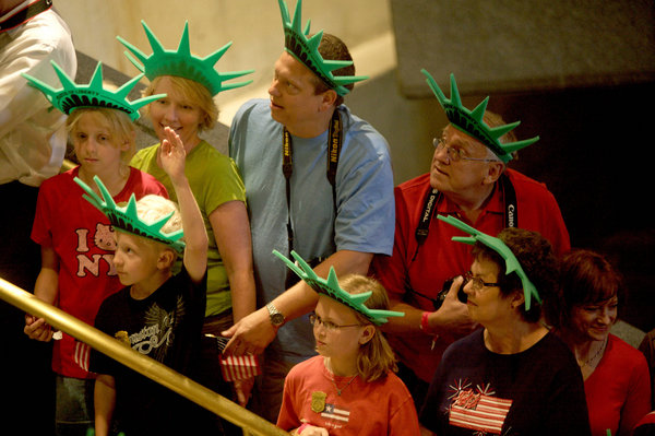  Visitors wearing Statue of Liberty crowns attends official ceremony of the reopening to the public of the crown of the Statue of Liberty. [CFP]