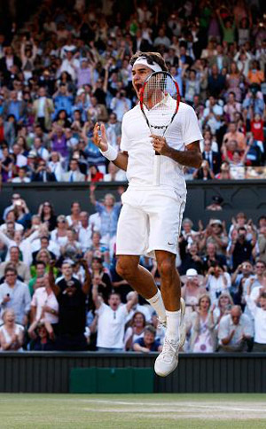 Roger Federer of Switzerland celebrates his victory after beating Andy Roddick of the U.S. 5-7, 7-6, 7-6, 3-6, 16-14, in the Men's Singles Final of the 2009 Wimbledon Tennis Championships at the All England Tennis Club, in southwest London, on July 5, 2009.(Xinhua Photo) 