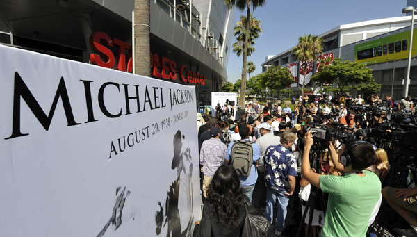 Members of the media listen to a news conference at the Staples Center in Los Angeles, Friday, July 3, 2009, announcing plans for the late pop star Michael Jackson's memorial service Tuesday. 