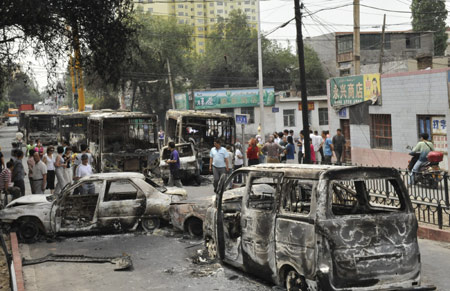 Vehicles set on fire and destroyed in Sunday night's riot are seen on Beiwan Street in Urumqi, capital of northwest China's Xinjiang Uygur Autonomous Region, July 6, 2009. (Xinhua/Shen Qiao)