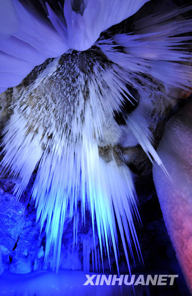 The photo taken on Thursday, July 2, 2009, shows an underground ice crystal cave that dates back 3 million years. The cavern, located in Ningwu County, northern Shanxi Province, consists of five floors and runs to a depth of about 100 meters. Various shapes of ice crystals are clear and shining, turning the cave into a crystal grotto. [Photo: Xinhuanet]