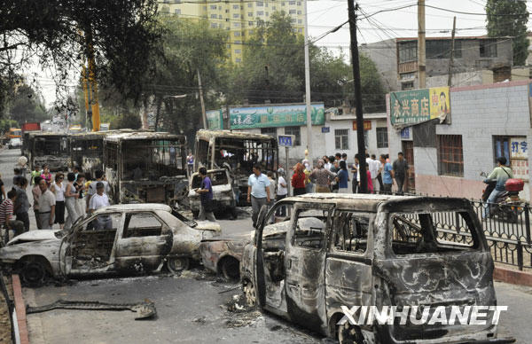 Vehicles set on fire and destroyed in Sunday night&apos;s riot are seen on Beiwan Street in Urumqi, capital of northwest China&apos;s Xinjiang Uygur Autonomous Region, July 6, 2009. Death toll has risen to 156 following the riot Sunday evening in Urumqi, capital of northwest China&apos;s Xinjiang Uygur Autonomous Region, according to official sources. [Xinhua]